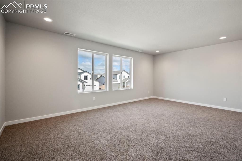 22132 Cattlemen Run Calhan, CO 80808 - Photo 34 of 43 an empty room with windows