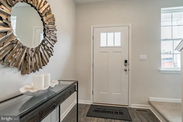 a bathroom with a mirror and a sink