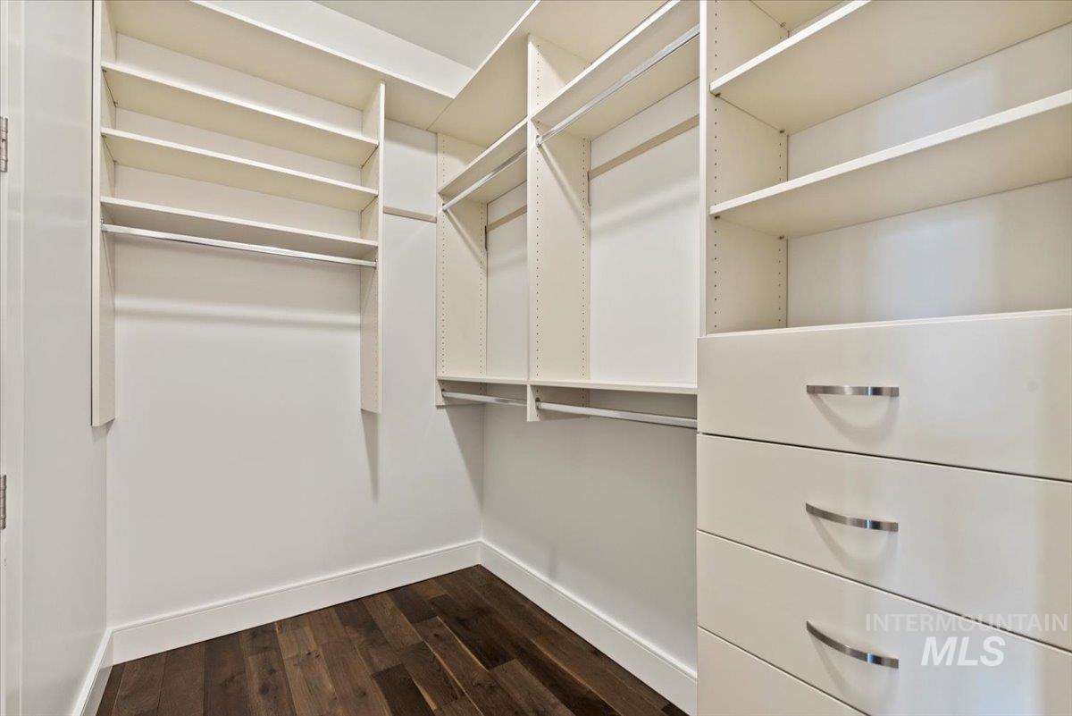 419 South 8th Street, Unit 309 Boise, ID 83702 - Photo 17 of 28 Walk in closet featuring dark wood-type flooring