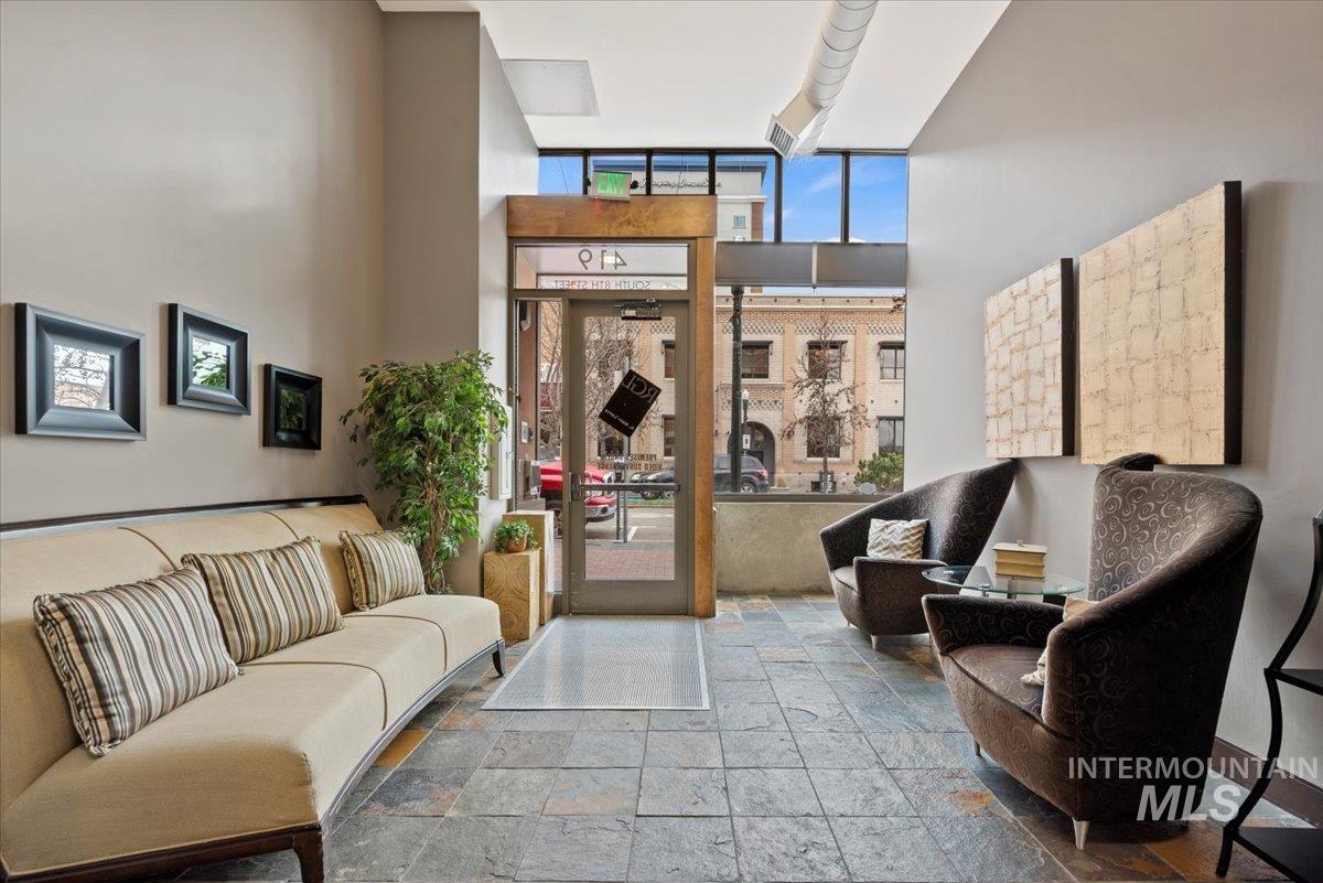 419 South 8th Street, Unit 309 Boise, ID 83702 - Photo 5 of 28 Community lobby with a high ceiling and a wall of windows