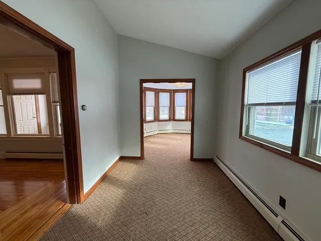 a view of hallway with livingroom