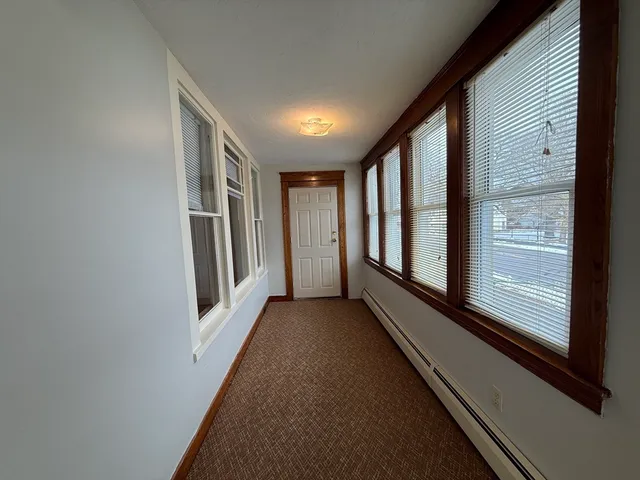 a view of hallway with windows