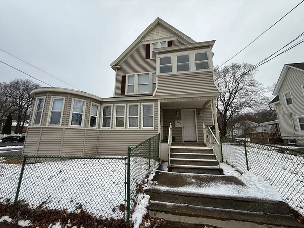 a front view of a house with stairs