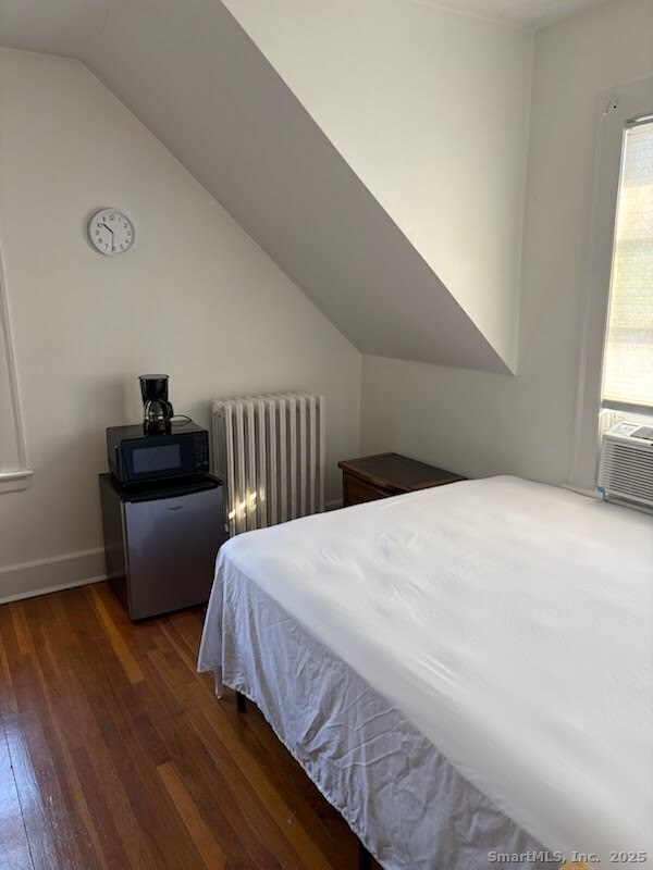 68 Adelaide Avenue Waterbury, CT 06708 - Photo 3 of 5 a bedroom with a bed and a couch