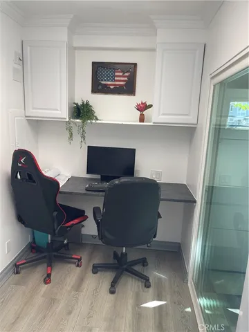 a workspace with furniture and wooden floor