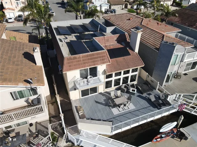 an aerial view of a house with a ocean view
