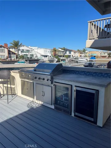 a kitchen with stainless steel appliances granite countertop a stove and a wooden floors