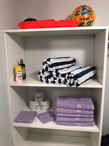 a kitchen sink with stove and cabinets