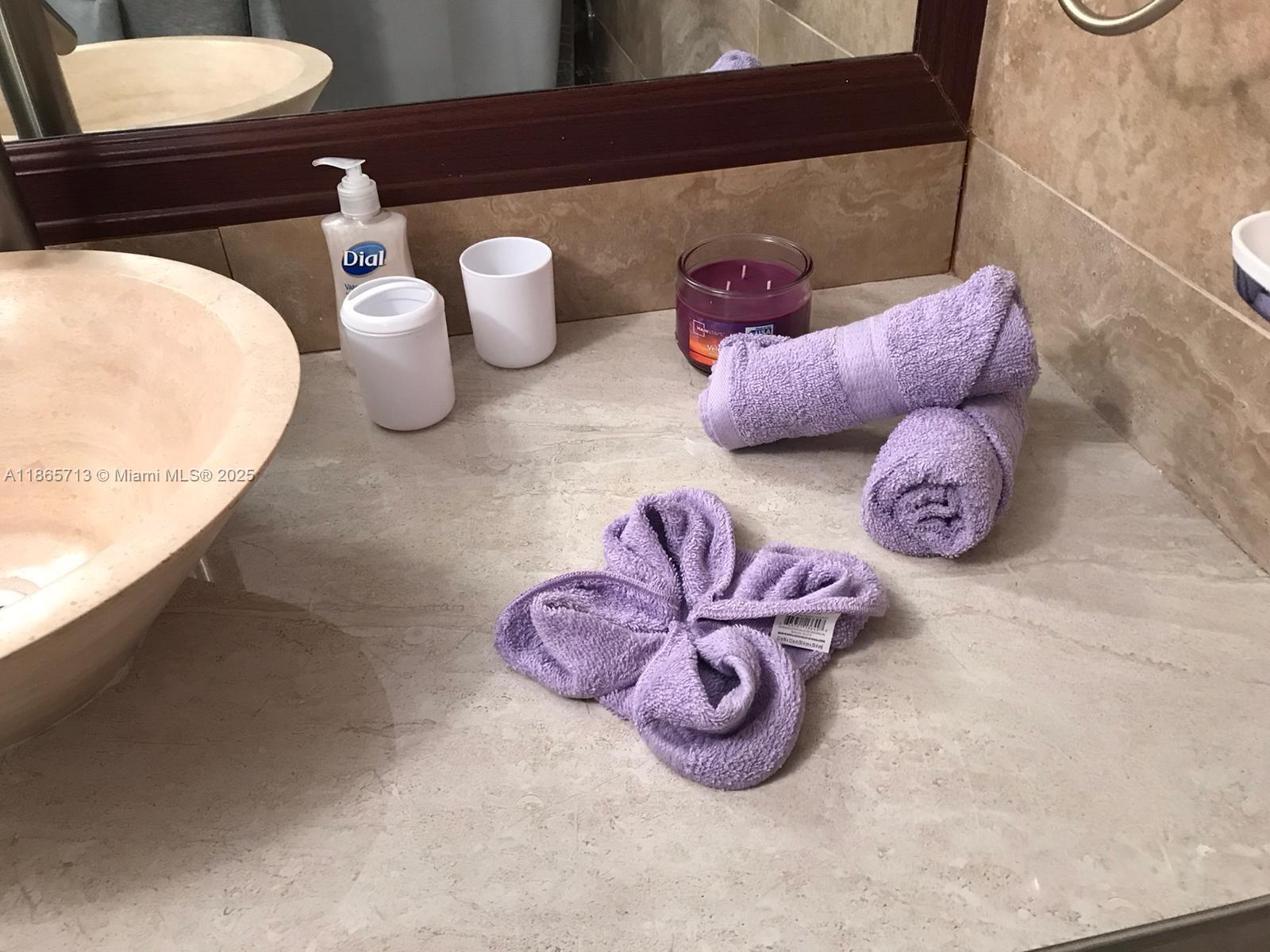 26 Diplomat Parkway, Unit 2215 Hallandale Beach, FL 33009 - Photo 10 of 12 a bathroom with a sink and toilet