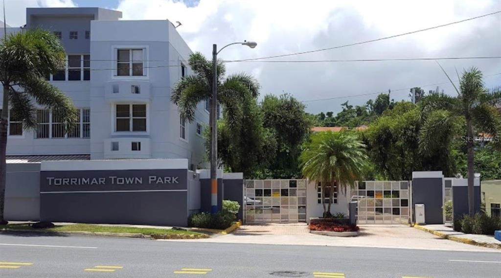 290 Av. Sta. Ana Guaynabo, Bayamón 00969 - Photo 1 of 23 a building with a street sign on the side of it