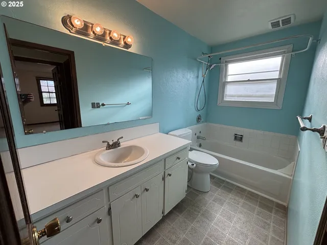 a bathroom with a sink and a bathtub