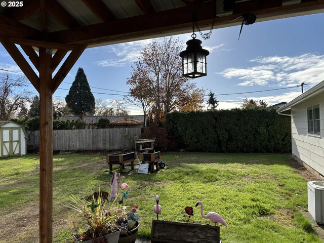 a view of a backyard with sitting area