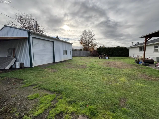 a backyard of a house with lots of green space