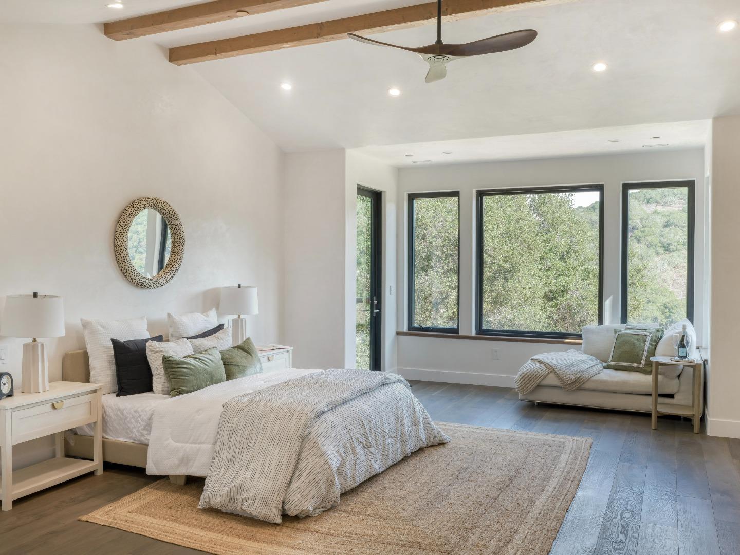 8380 Monterra Views Monterey, CA 93940 - Photo 14 of 45 a spacious bedroom with a bed couch and a large window