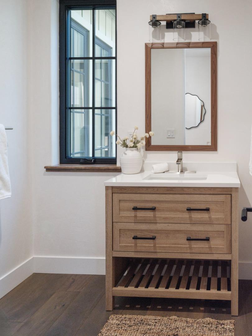 8380 Monterra Views Monterey, CA 93940 - Photo 27 of 45 a bathroom with a sink a mirror and a window