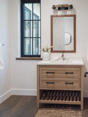 front view of a house with a large trees