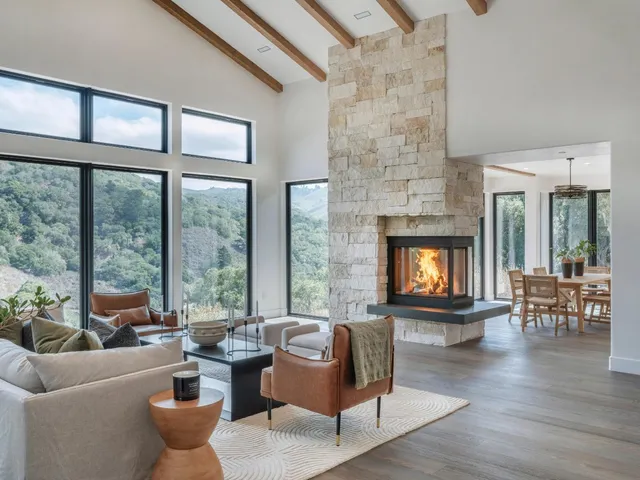 a large kitchen with a table and chairs