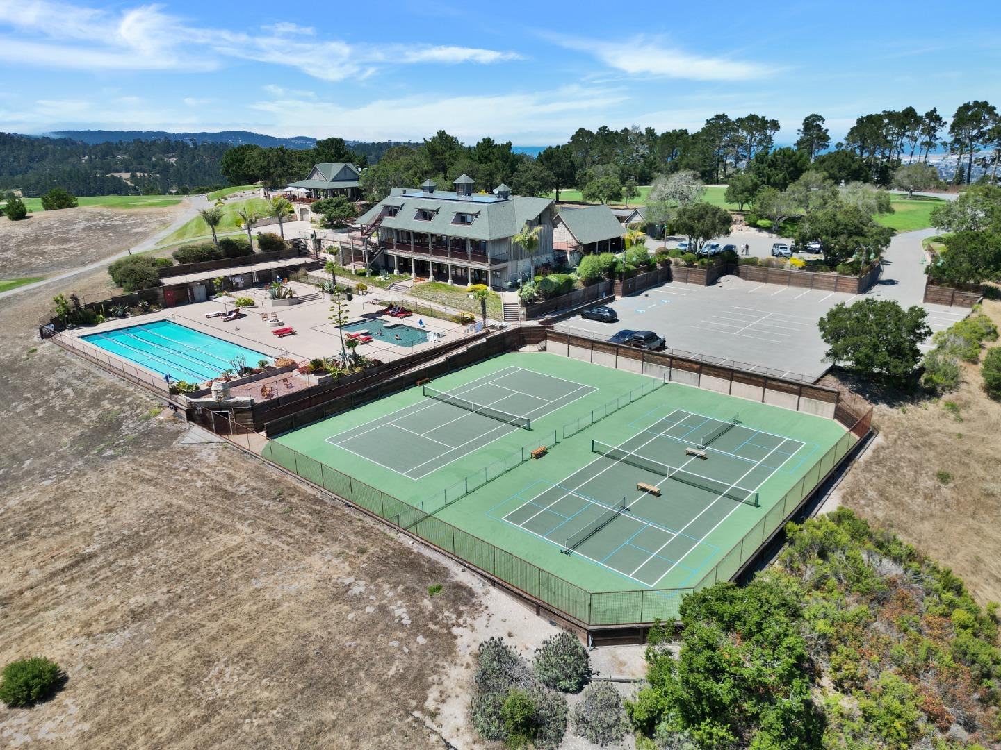 8380 Monterra Views Monterey, CA 93940 - Photo 44 of 45 an aerial view of a tennis ground with large trees and houses