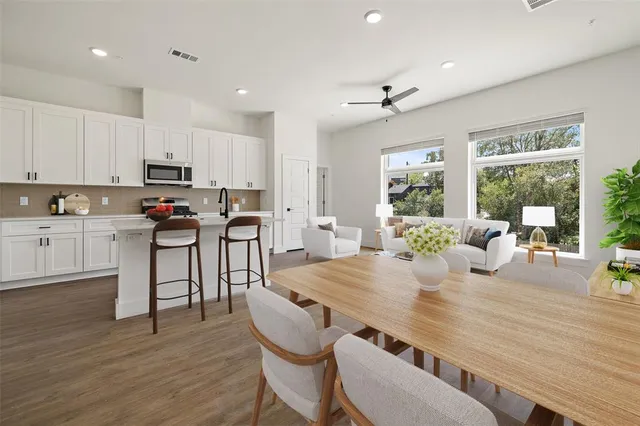 a view of a dining room with furniture and wooden floor