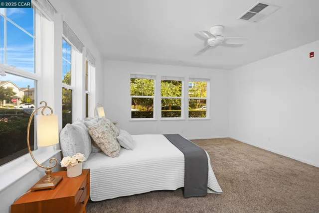 a bedroom with a bed and window