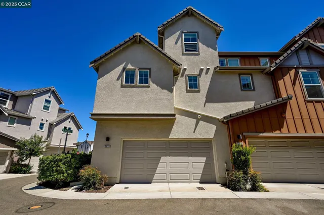 a front view of a house with garage