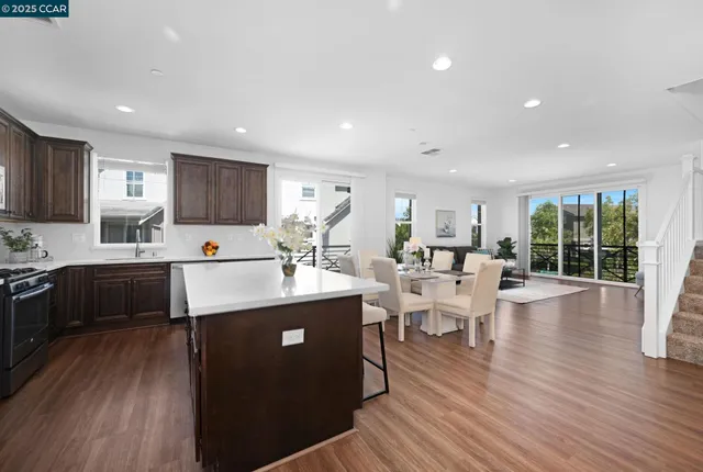 a kitchen with counter top space a sink appliances and cabinets