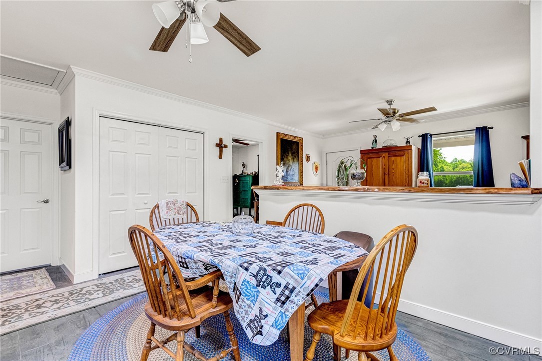 274 Regina Road Lancaster, VA 22503 - Photo 12 of 26 a dining room with furniture and wooden floor