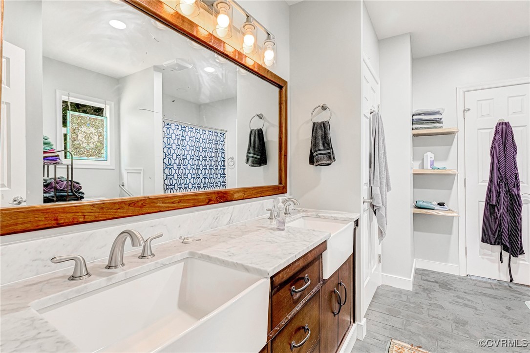 274 Regina Road Lancaster, VA 22503 - Photo 17 of 26 a bathroom with a sink and a mirror