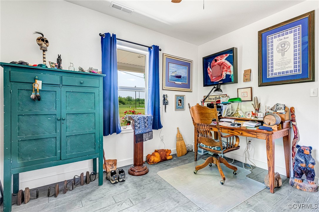 274 Regina Road Lancaster, VA 22503 - Photo 21 of 26 a view of a workspace with furniture and a window