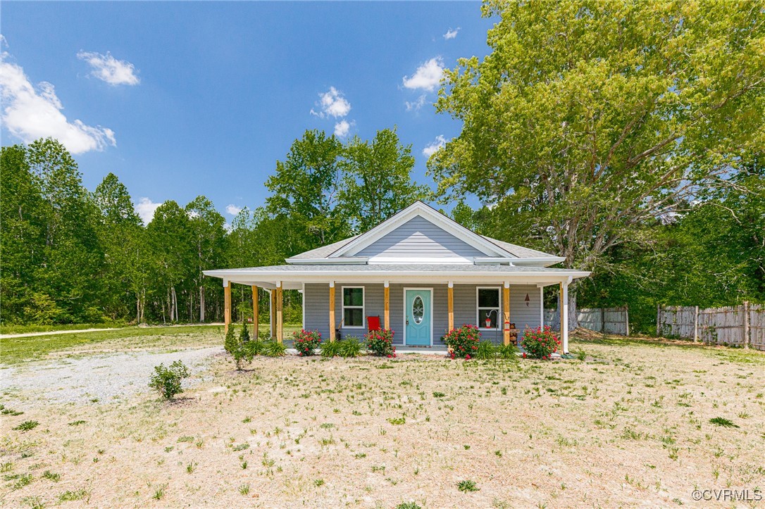 274 Regina Road Lancaster, VA 22503 - Photo 26 of 26 a front view of a house with garden