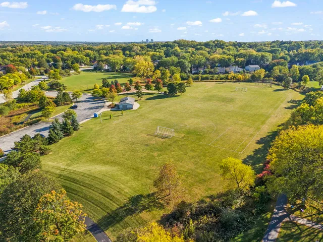 a view of a swimming pool with a yard