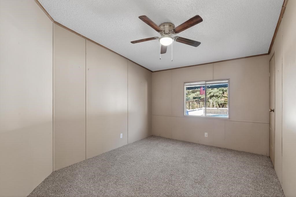 2744 Roy Sikes Road Hilliard, FL 32046 - Photo 41 of 97 an empty room with windows and ceiling fan