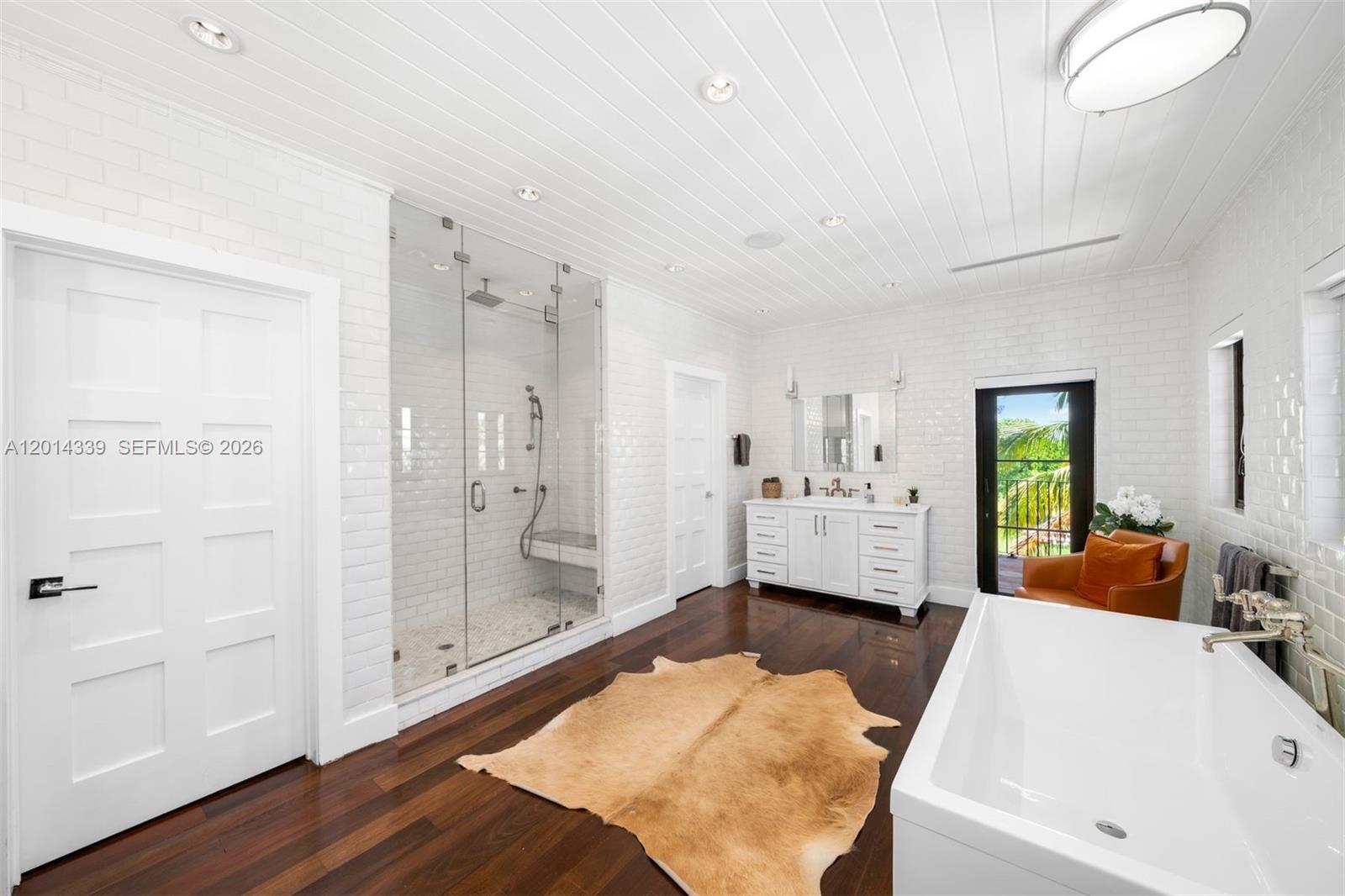 1201 Northeast 83rd Street Miami, FL 33138 - Photo 19 of 42 a large spacious bathroom with a tub and shower
