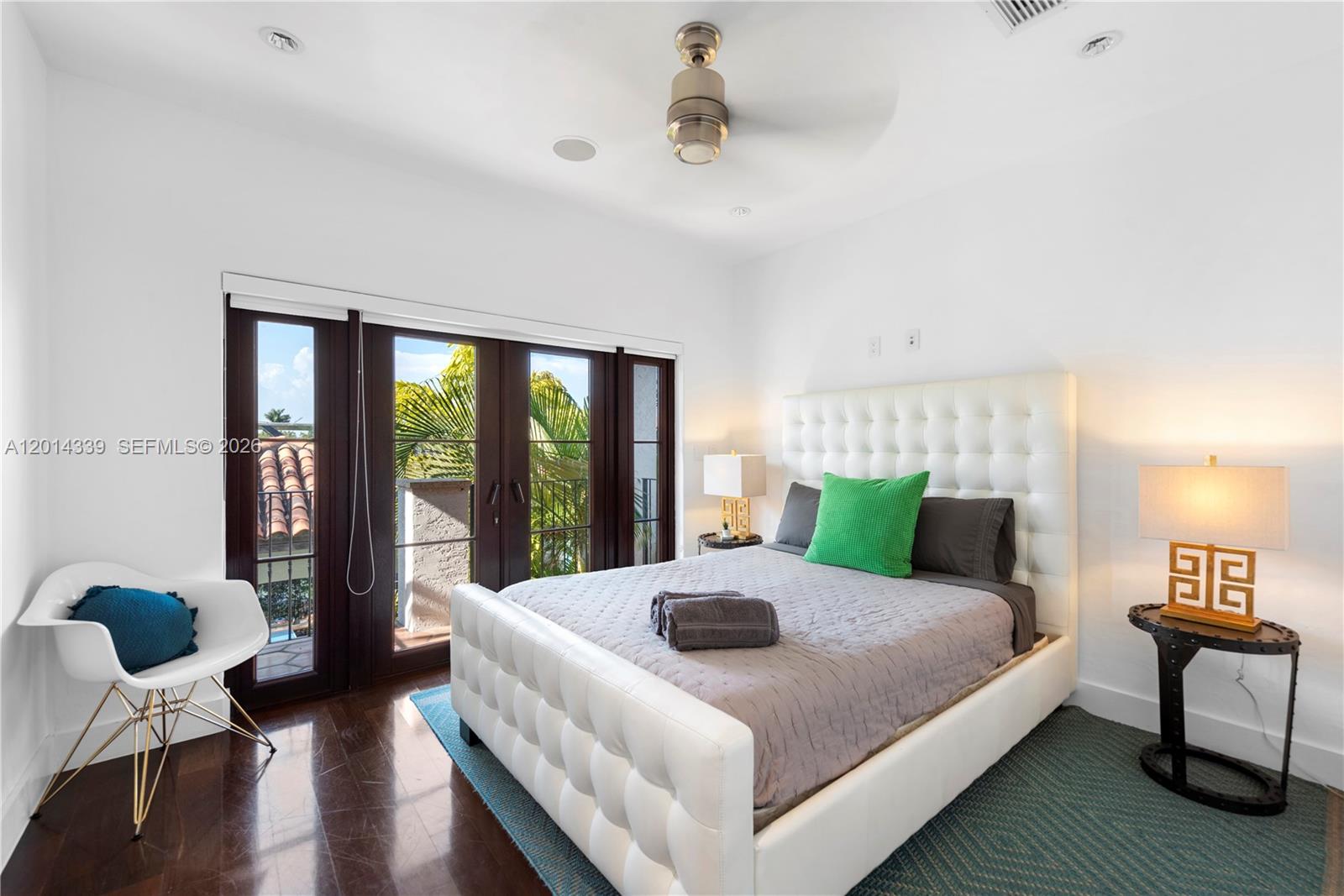 1201 Northeast 83rd Street Miami, FL 33138 - Photo 23 of 42 a bed room with a bed and a chair