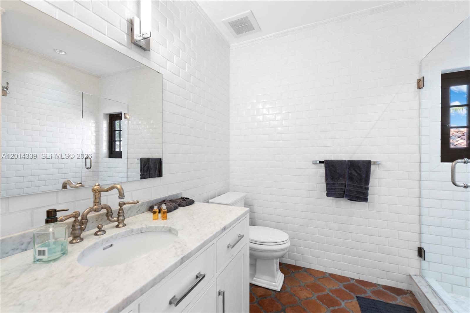 1201 Northeast 83rd Street Miami, FL 33138 - Photo 25 of 42 a bathroom with a sink toilet and mirror