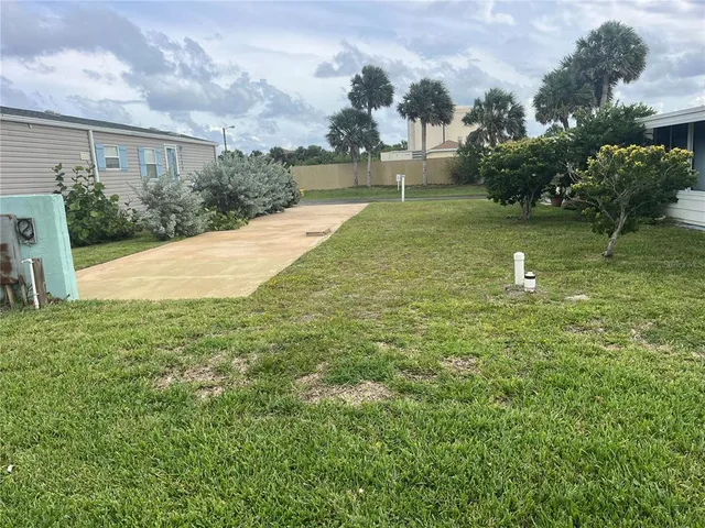 a swimming pool with trees in the background