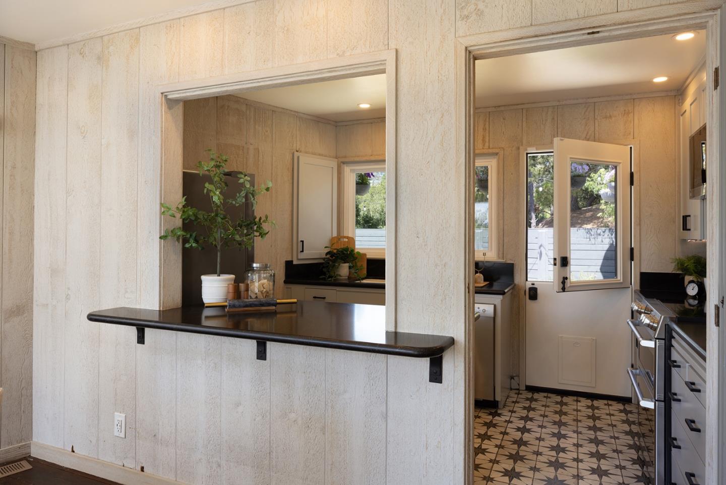 5165 Carmel Valley Road Carmel, CA 93923 - Photo 11 of 19 a hallway with a view of living room with furniture and wooden floor