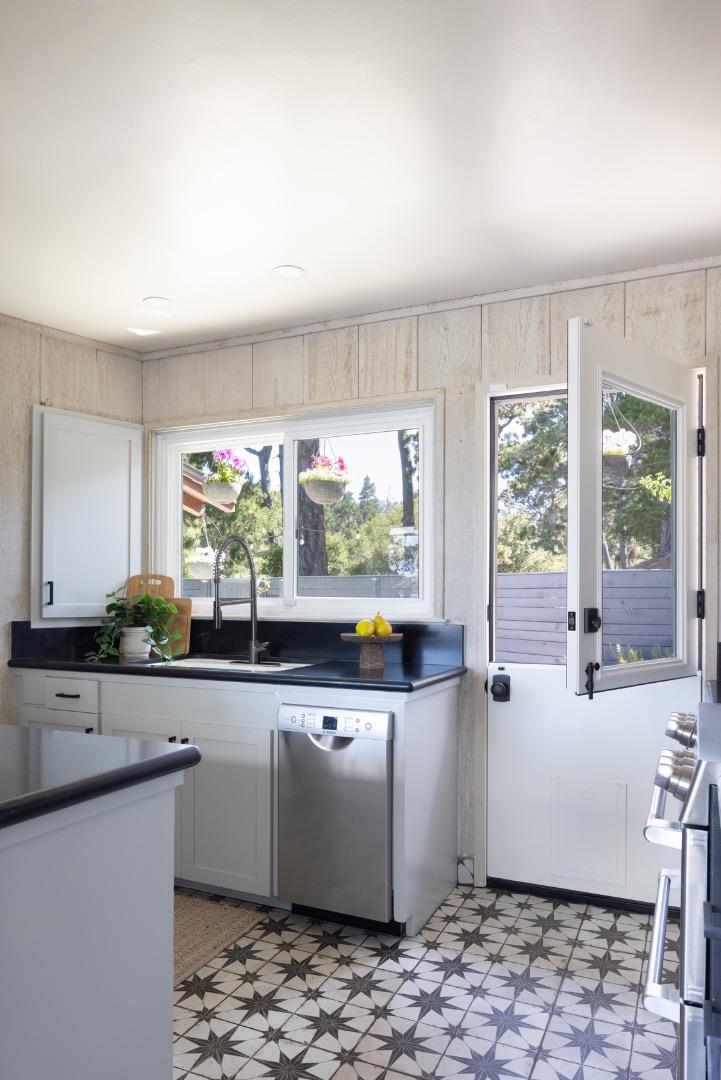 5165 Carmel Valley Road Carmel, CA 93923 - Photo 12 of 19 a large white kitchen with a large window