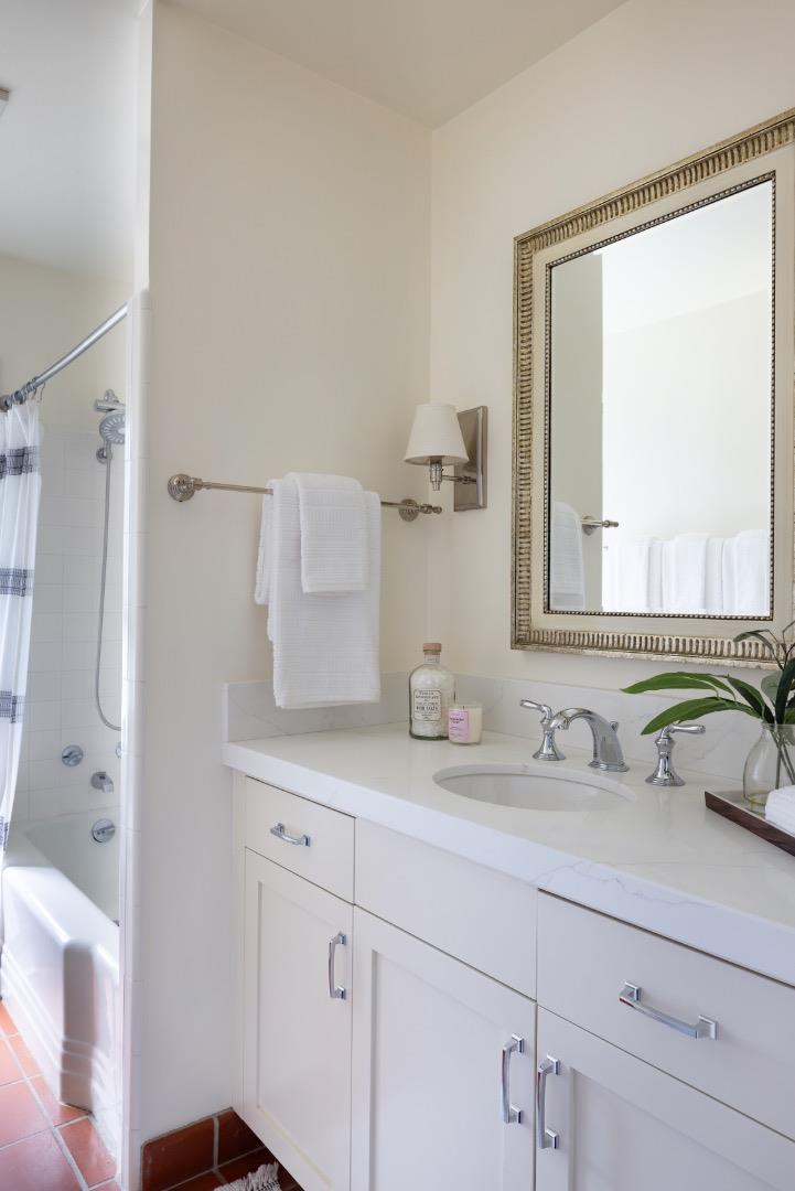 5165 Carmel Valley Road Carmel, CA 93923 - Photo 16 of 19 a bathroom with a double vanity sink mirror and double