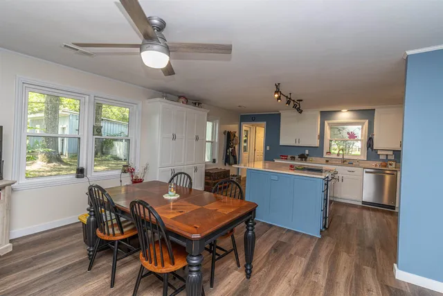 a view of a dining room with furniture window and wooden floor