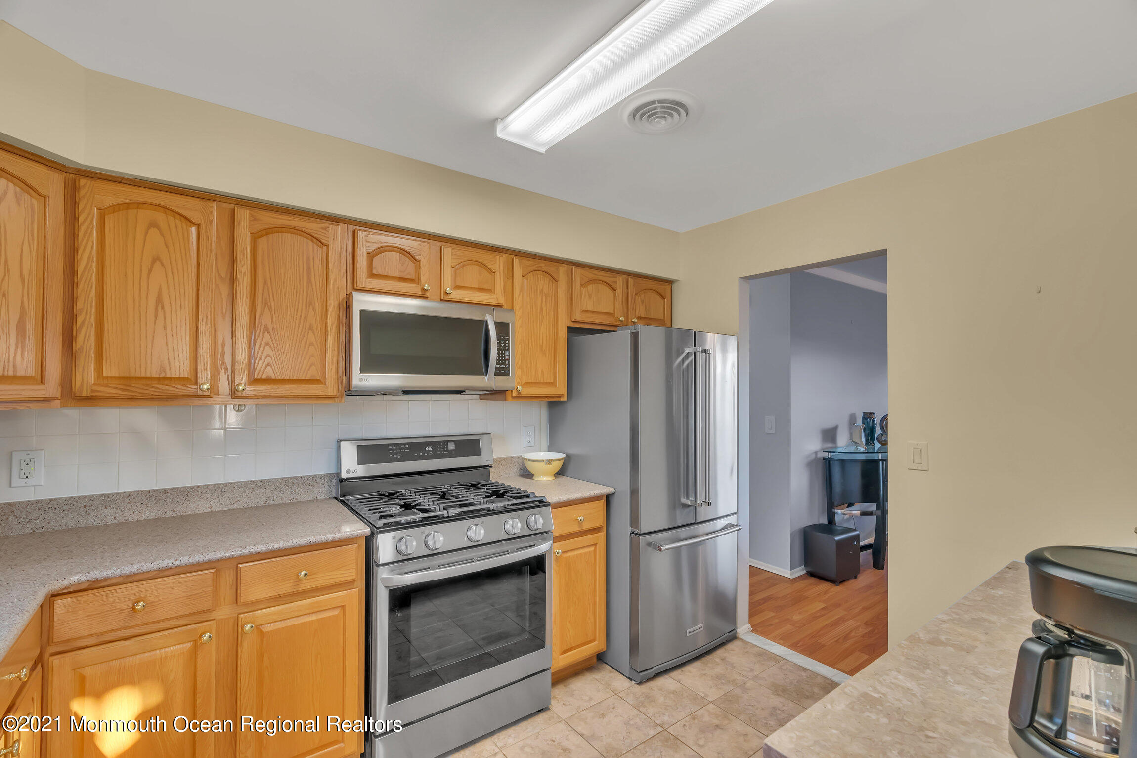 2 Coventry Road Toms River, NJ 08757 - Photo 11 of 25 a kitchen with stainless steel appliances a stove microwave and refrigerator