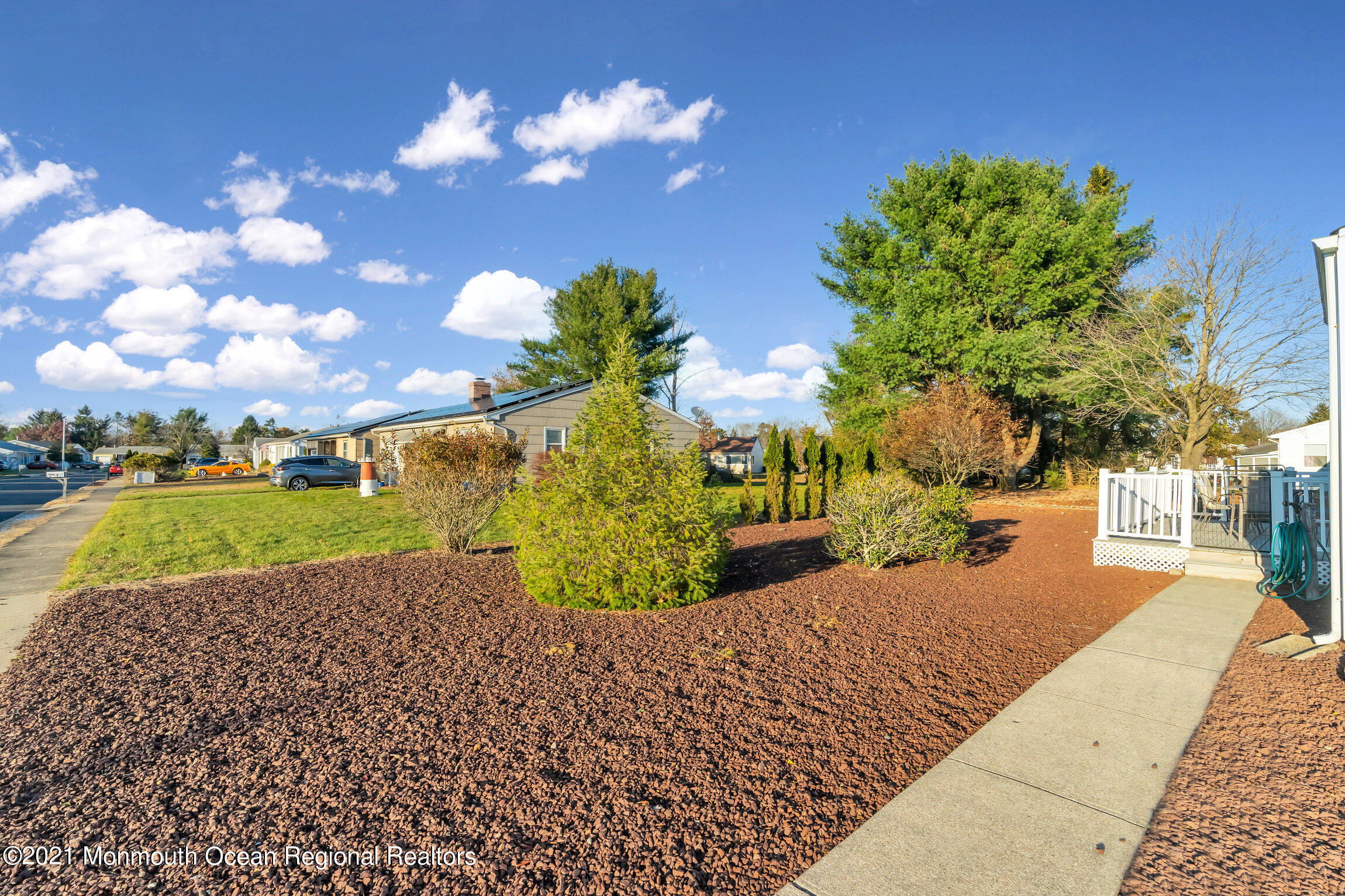 2 Coventry Road Toms River, NJ 08757 - Photo 25 of 25 a view of a yard with flower plants