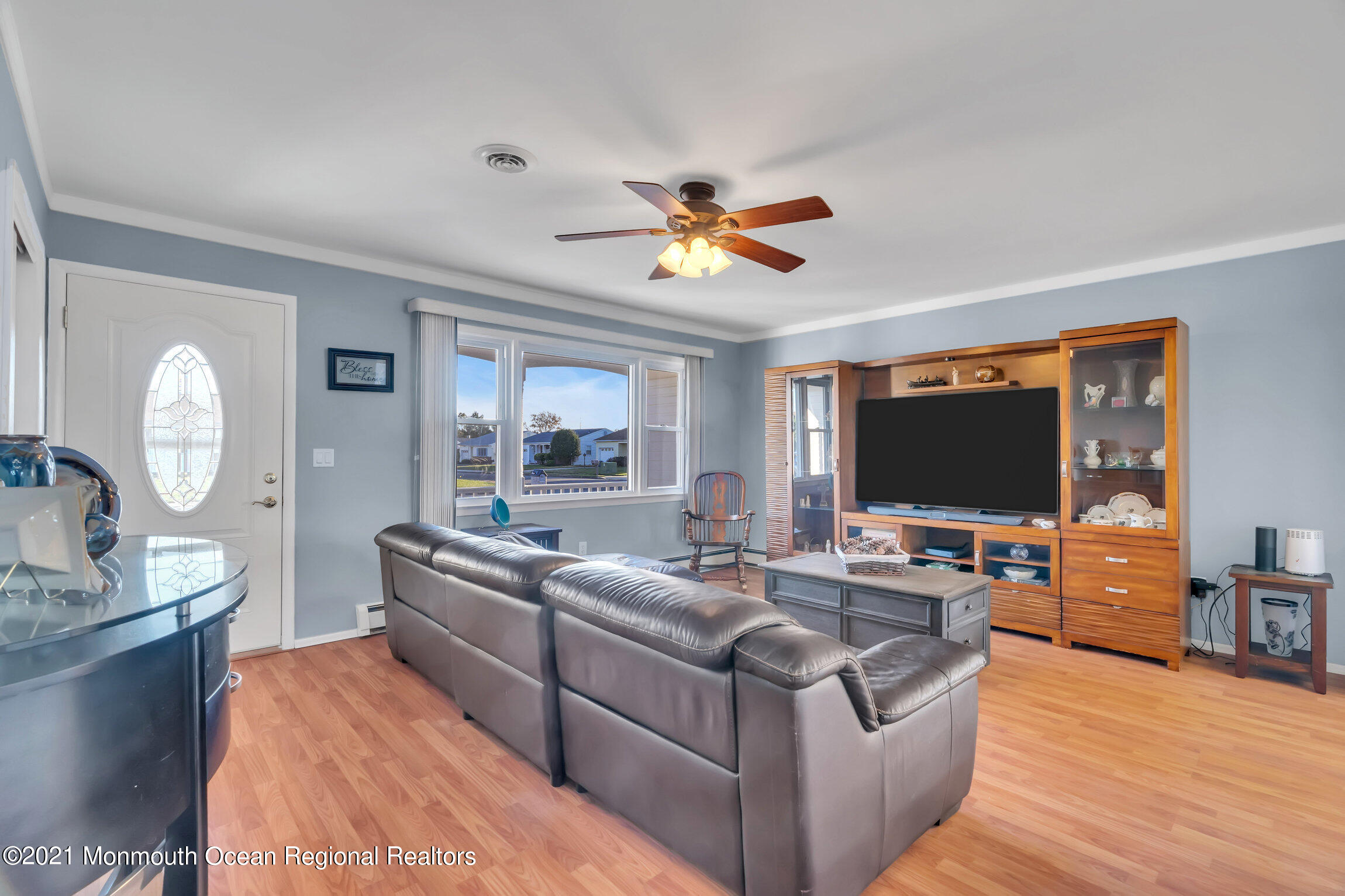 2 Coventry Road Toms River, NJ 08757 - Photo 8 of 25 a living room with furniture a flat screen tv and a large window