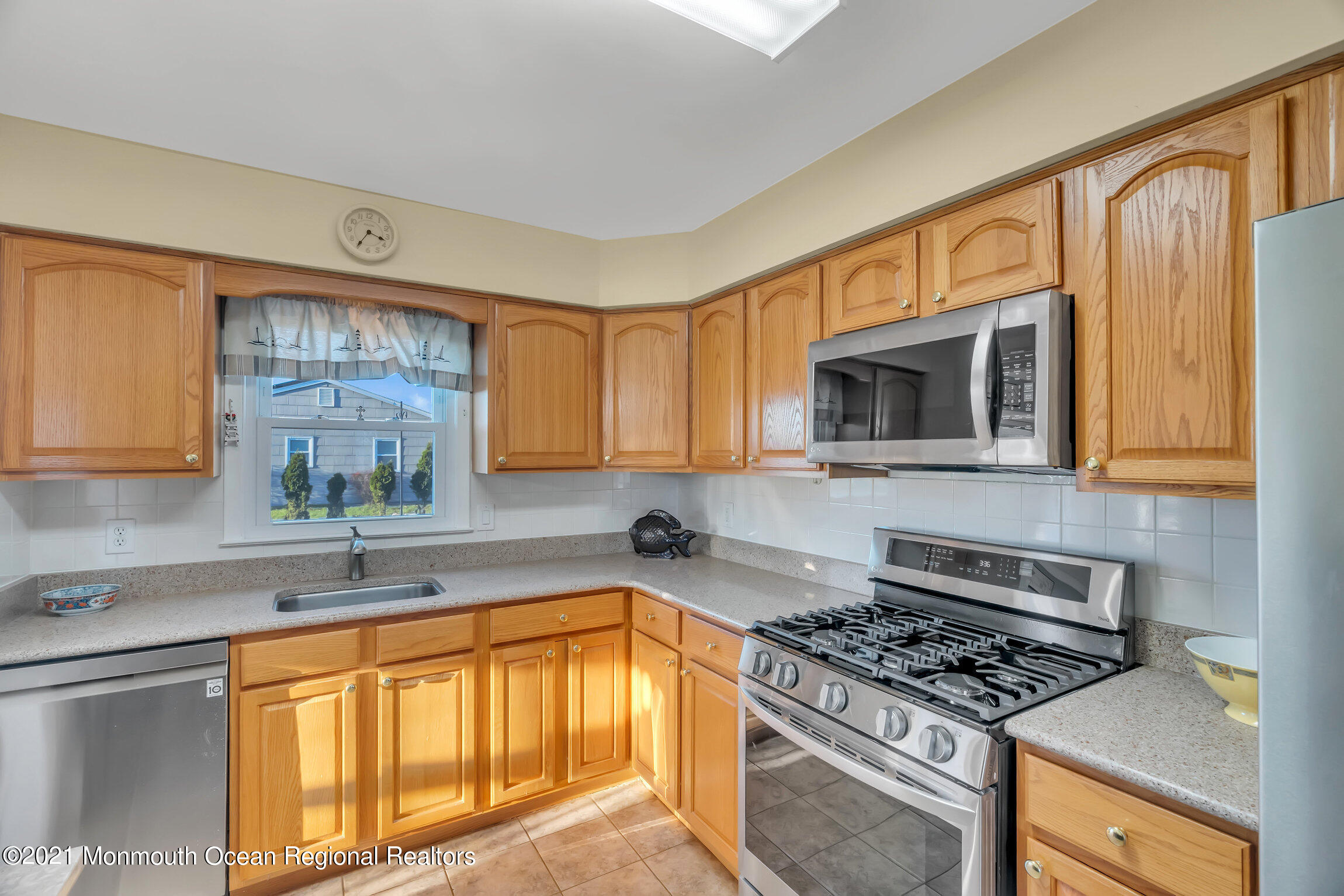2 Coventry Road Toms River, NJ 08757 - Photo 10 of 25 a kitchen with stainless steel appliances granite countertop a stove a sink and a microwave