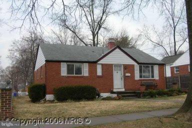 12824 Matey Road Silver Spring, MD 20906 - Photo 1 of 1 a front view of a house with garden