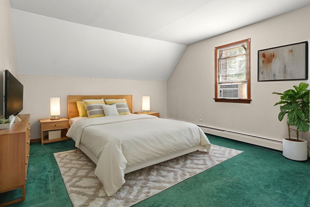 31 Kimball Road Amesbury, MA 01913 - Photo 18 of 40 a bedroom with a bed and a flat screen tv