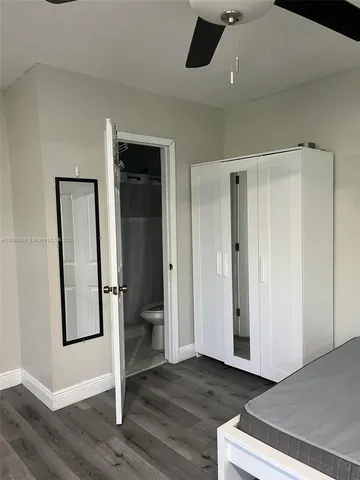 a view of a livingroom with wooden floor