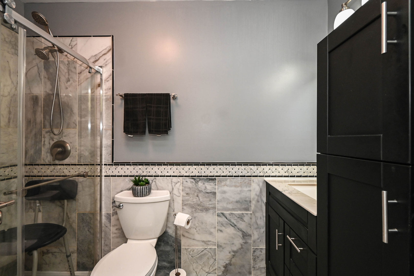 1333 Regency Lane Round Lake, IL 60073 - Photo 19 of 31 a bathroom with a toilet and a shower