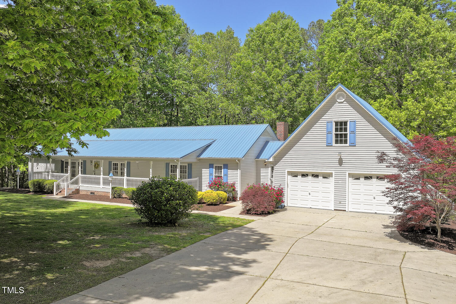134 Rollins Mill Road Holly Springs, NC 27540 - Photo 1 of 33 a front view of a house with garden