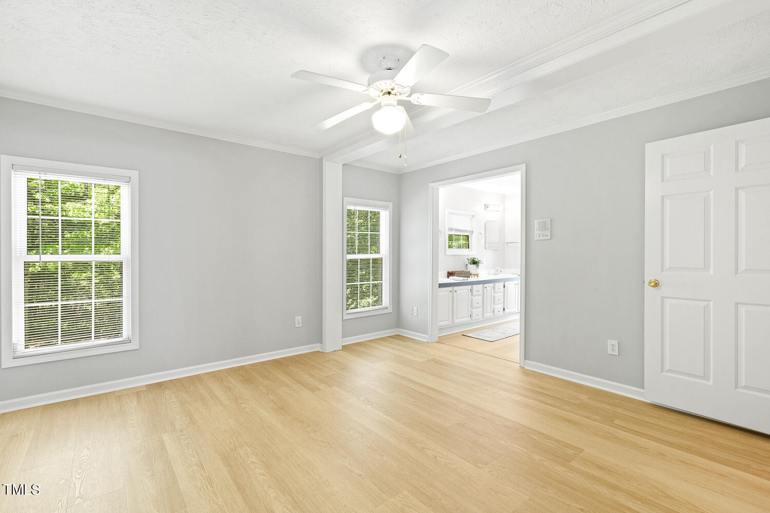 134 Rollins Mill Road Holly Springs, NC 27540 - Photo 15 of 33 a view of an empty room with a window and wooden floor